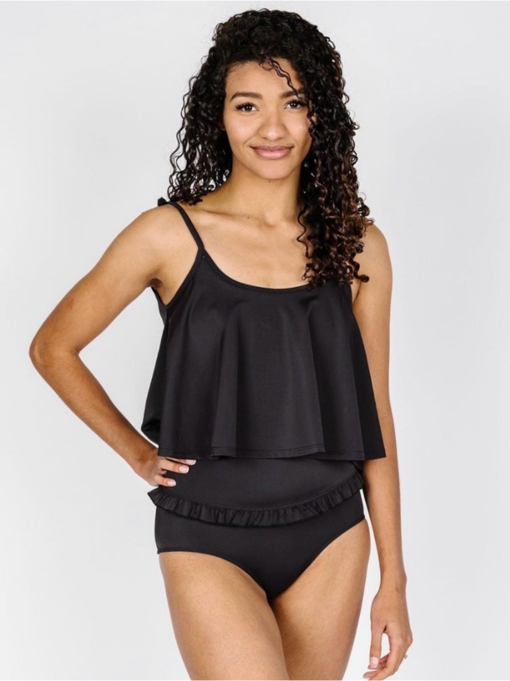 Black Kortni Jeane tankini top with a loose fit and built in bra